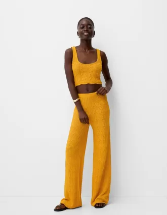 Pantaloni rustici svasati in maglia aperta