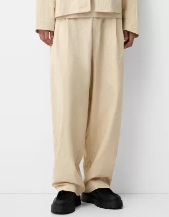 Pantaloni super larghi con piega