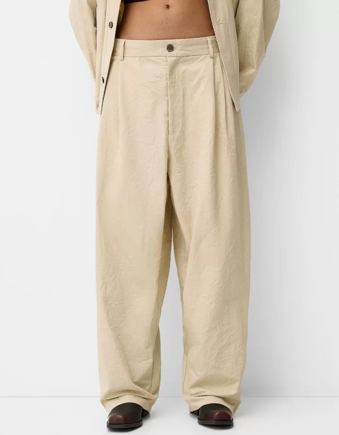 Pantaloni super larghi con piega