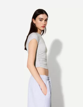 T-shirt a manica corta con arricciatura laterale