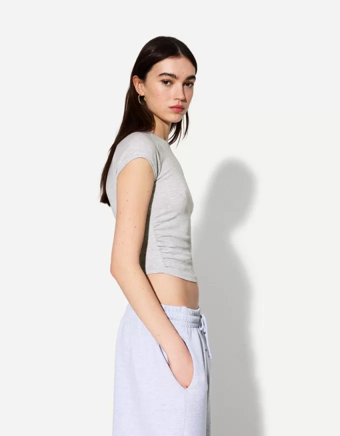 T-shirt a manica corta con arricciatura laterale