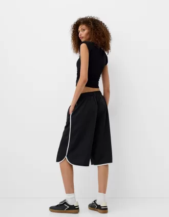 T-shirt a maniche corte con spalline