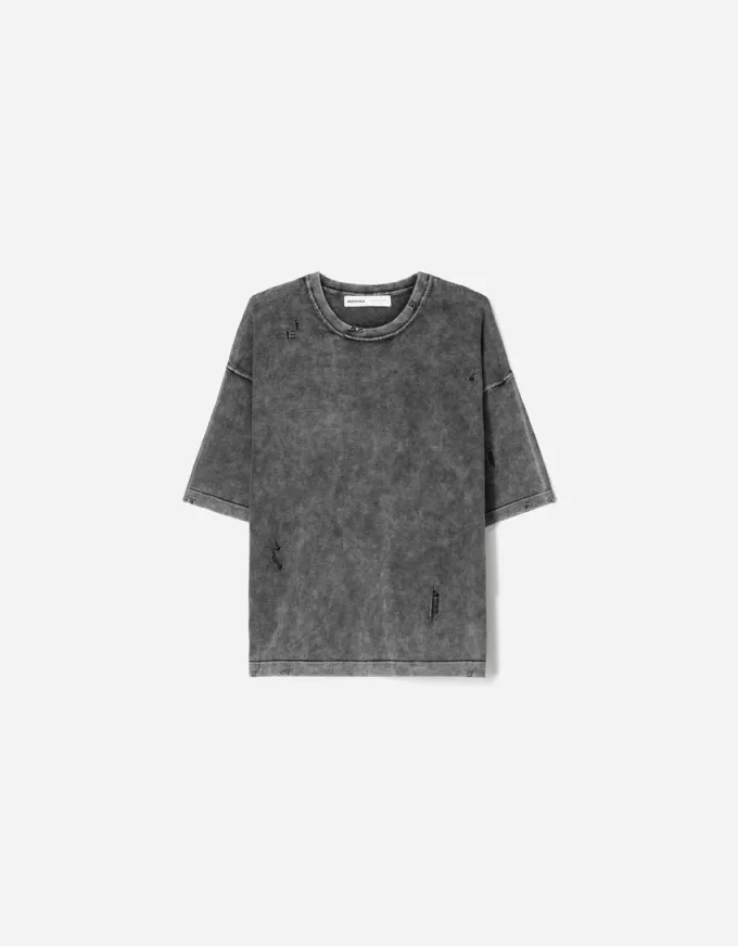 T-shirt a maniche corte strappata