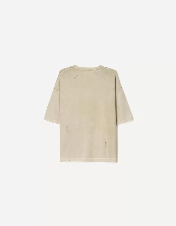 T-shirt a maniche corte strappata