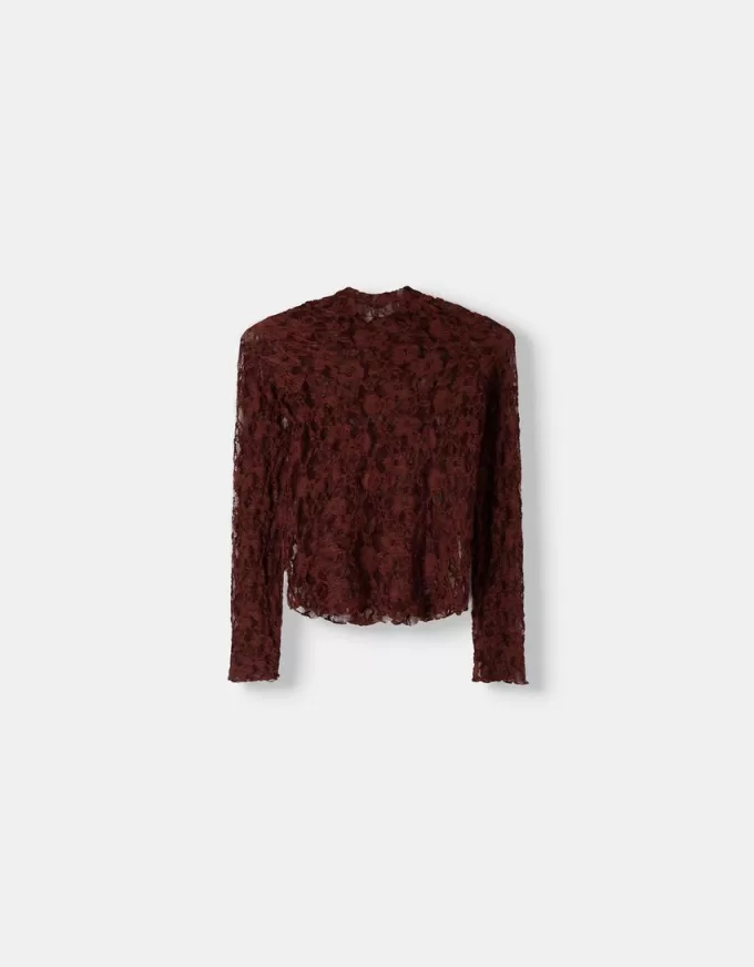 T-shirt bionda a maniche lunghe con collo alto in pizzo