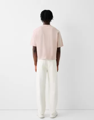 T-shirt corta a maniche corte dal taglio squadrato