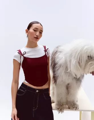 Top a corsetto con fiocchi