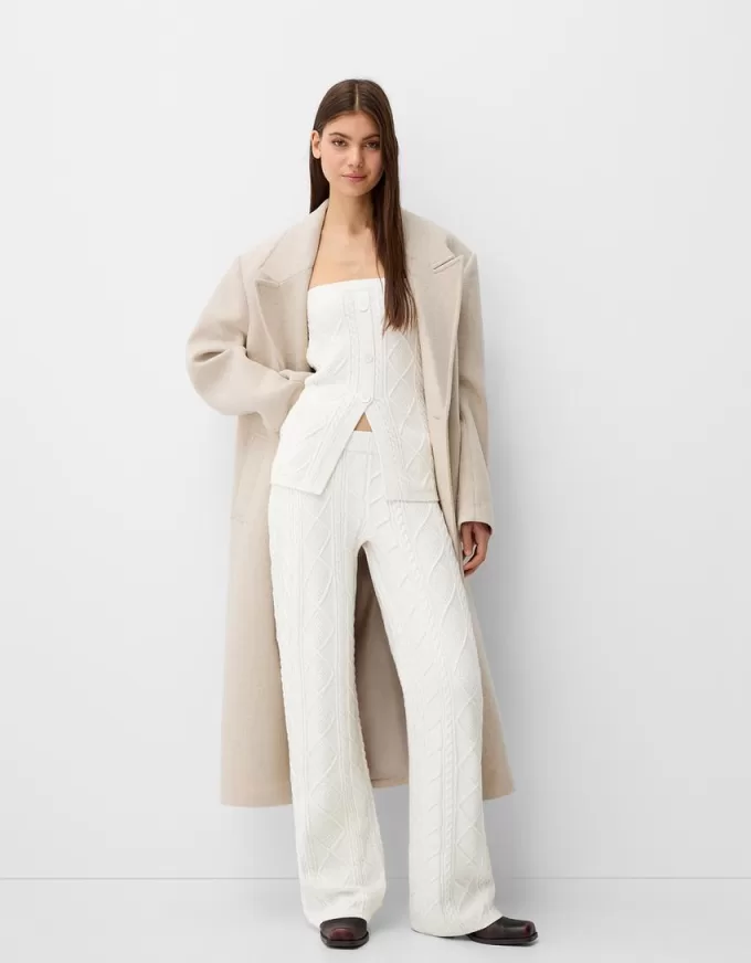 Top a fascia in maglia a trecce