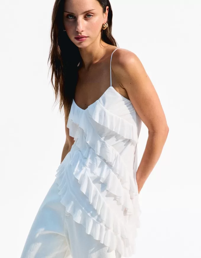 Top asimmetrico con volant SERIE BERSHKA