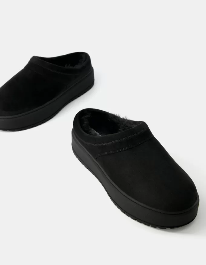 Zoccoli con plateau e fodera in pelliccia sintetica